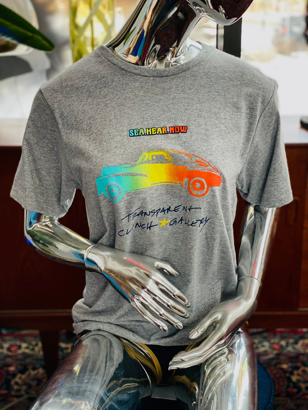 Sea.Hear.Now Transparent Clinch Gallery T-Shirt - Transparent Clinch Gallery
